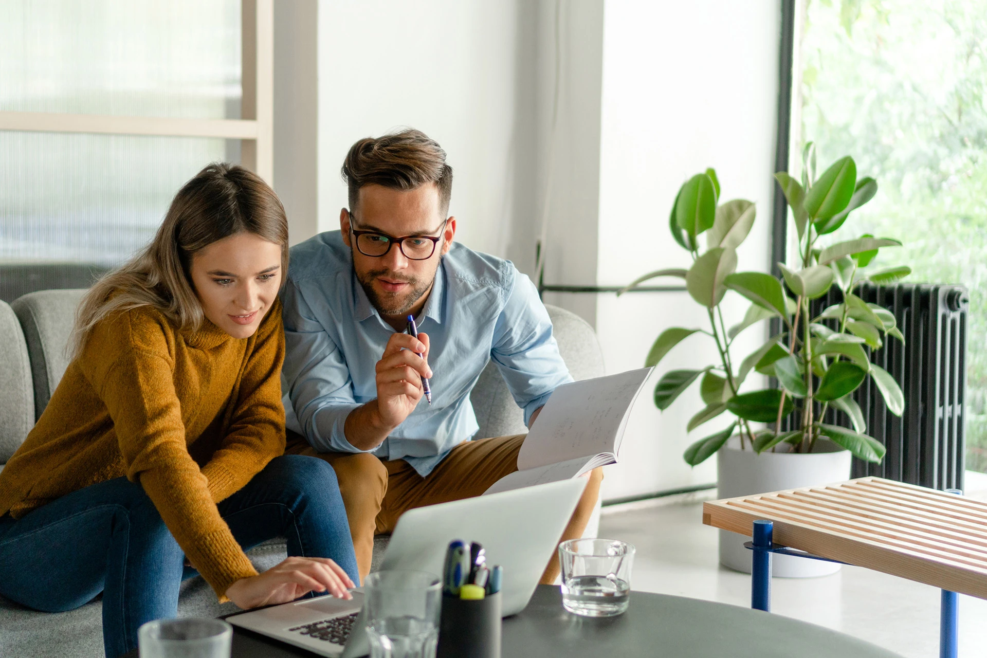 Vega Lend couple searching for property on laptop