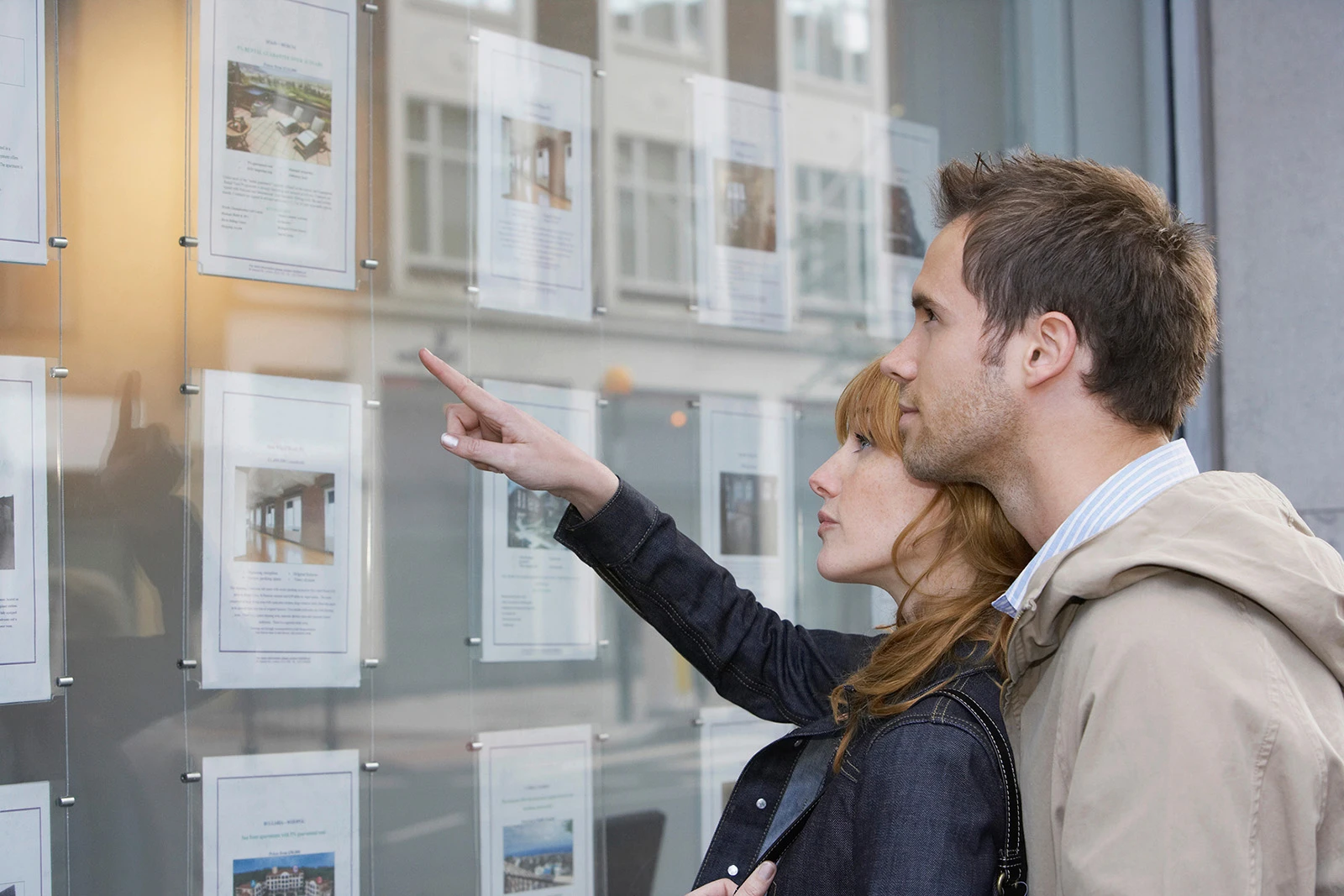 Vege Lend couple pointing property ads