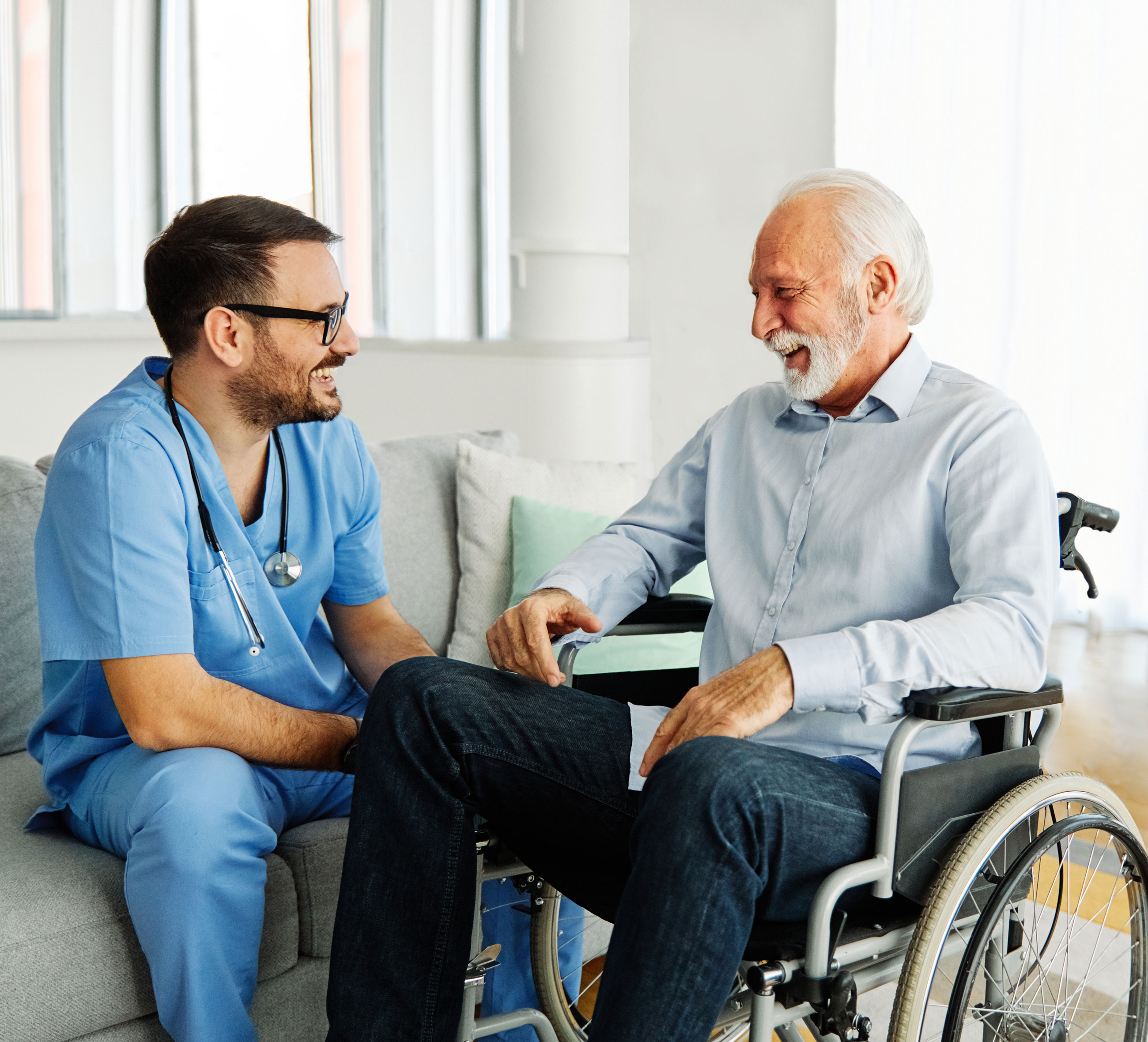 senior care caregiver help assistence wheelchair retirement home nursing elderly man disabled disability